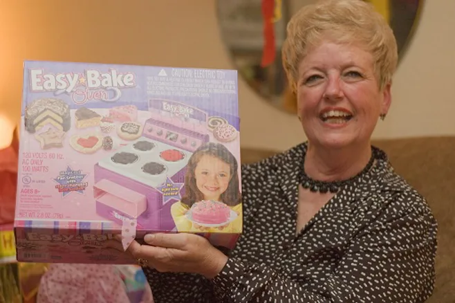 Grandma holding easy bake oven. Grandma holding easy bake oven.